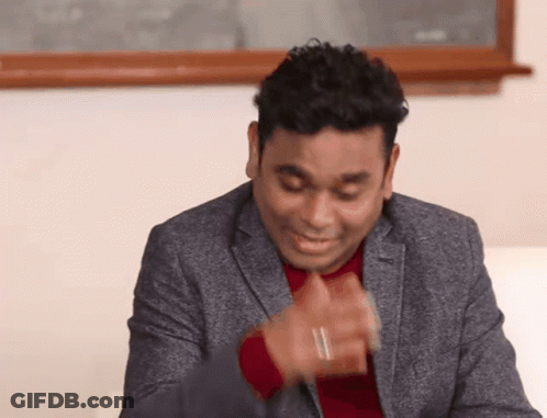 Man In Suit Making Funny Face With Hands GIF