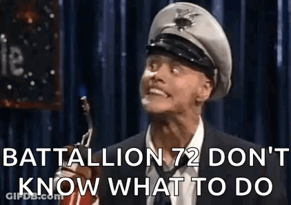 Man In Suit Making Funny Face With Military Hat GIF