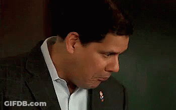 Man In Suit Making Funny Face With Mouth Open GIF