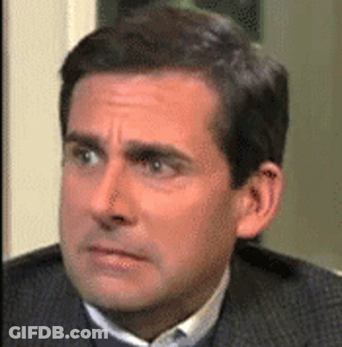 Man In Suit Making Funny Face GIF