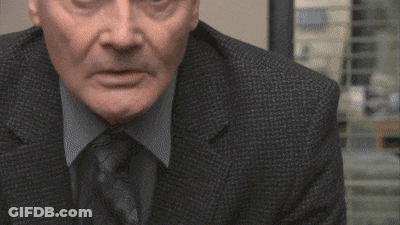 Man In Suit Making Funny Face GIF