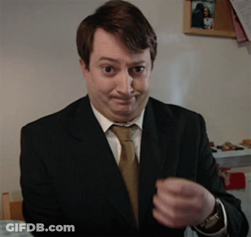 Man In Suit Making Funny Face GIF