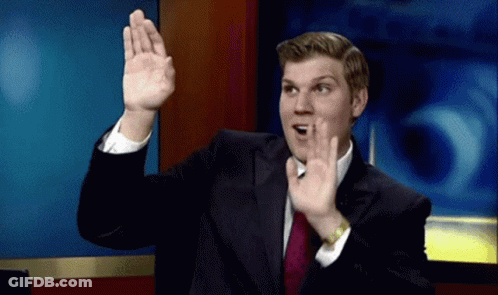 Man In Suit Making Gesture GIF