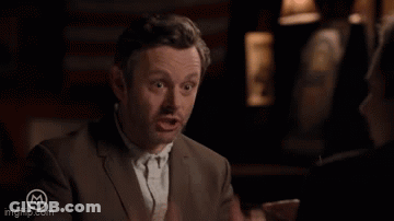 Man In Suit Making Gesture GIF