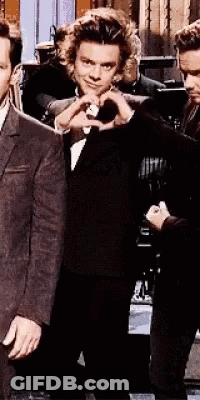 Man In Suit Making Heart Shape With Hand GIF