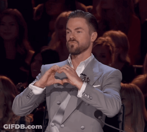 Man In Suit Making Heart With Hands GIF