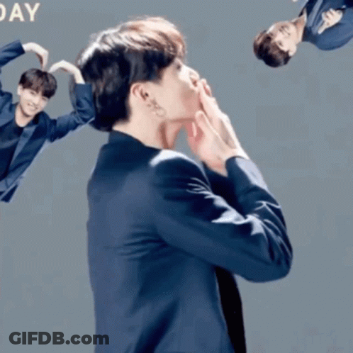Man In Suit Making Heart With Hands Saying Day GIF