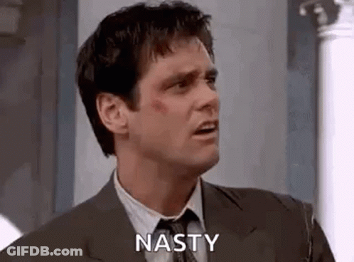 Man In Suit Making Nasty Face GIF