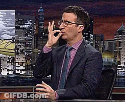 Man In Suit Making OK Sign At Desk GIF