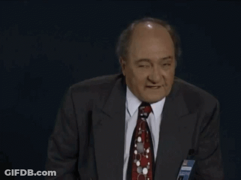 Man In Suit Making Rude Gesture GIF