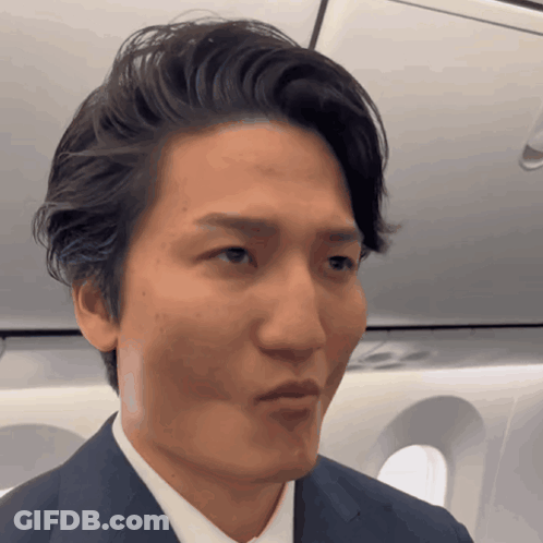 Man In Suit Making Silly Face GIF