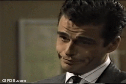 Man In Suit Making Silly Face GIF