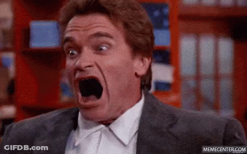 Man In Suit Making Surprised Face GIF