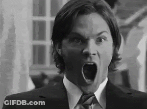 Man In Suit Making Surprised Face GIF