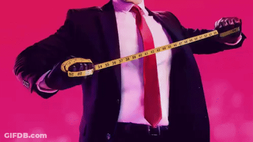 Man In Suit Measuring Chest With Yellow Tape Measure GIF