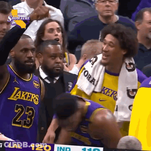 Man In Suit Next To Basketball Player 14 GIF
