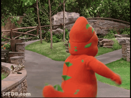 Man In Suit Next To Boy In Striped Vest In Crowd GIF