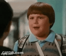 Man In Suit Next To Boy In Vest GIF