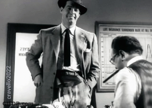 Man In Suit Next To Man At Life Insurance Surrender Rate Sign GIF