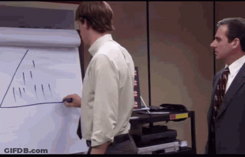 Man In Suit Next To Man Drawing On Whiteboard GIF