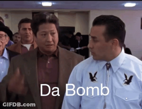 Man In Suit Next To Man In Blue Shirt Saying Da Bomb GIF