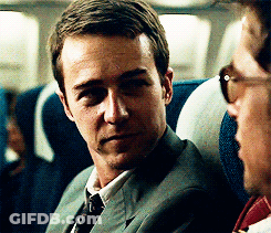 Man In Suit Next To Man In Sunglasses GIF