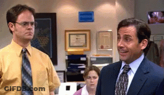 Man In Suit Next To Man In Yellow Shirt GIF
