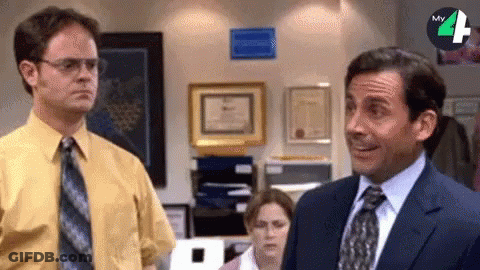 Man In Suit Next To Man In Yellow Shirt GIF