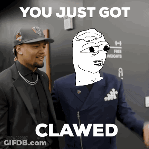 Man In Suit Next To Man Saying You Just Got Clawed GIF