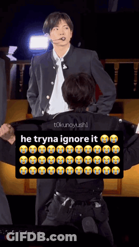 Man In Suit Next To Man With Sign Saying He Tryna Ignore It GIF