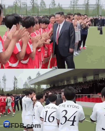 Man In Suit Next To Soccer Players With Numbers 16 34 GIF