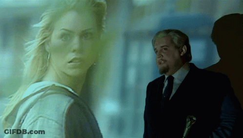 Man In Suit Next To Woman In Hoodie GIF