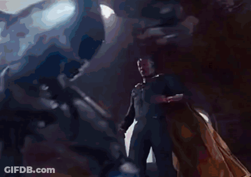 Man In Suit Next To Woman In Red Dress GIF