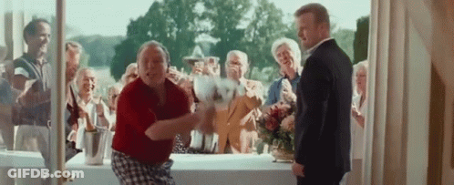 Man In Suit Next To Woman In Red Shirt Dancing GIF