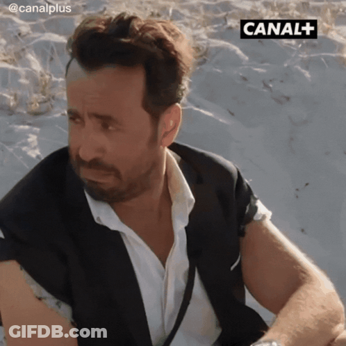 Man In Suit On Beach Canal+ GIF