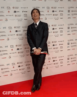 Man In Suit On Red Carpet Wall Ifta GIF