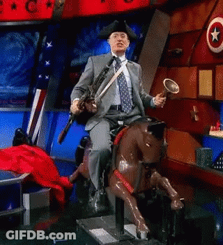 Man In Suit On Rocking Horse Holding Trumpet GIF