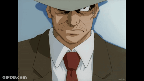 Man In Suit On Screen Saying Anix.to GIF
