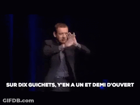 Man In Suit On Stage Arms Outstretched GIF