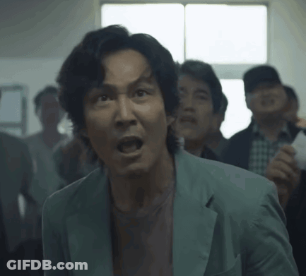 Man In Suit Open Mouth In Crowd GIF