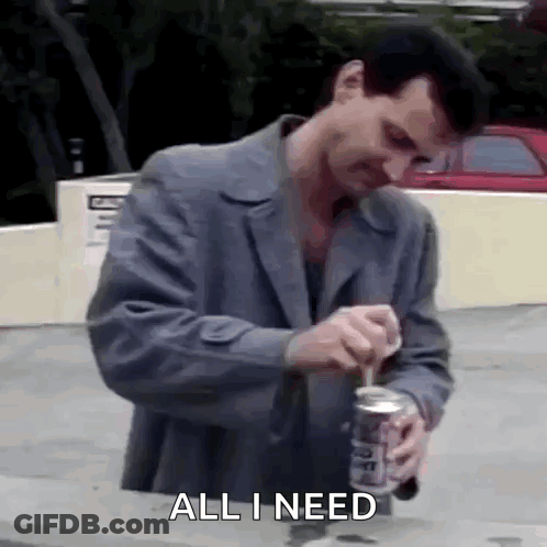 Man In Suit Opening Soda Saying All I Need GIF