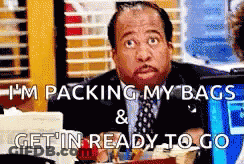 Man In Suit Packing Bags Ready To Go GIF
