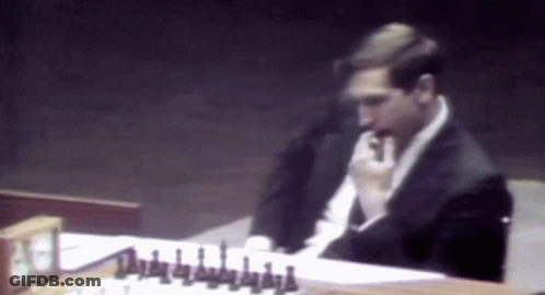Man In Suit Playing Chess GIF