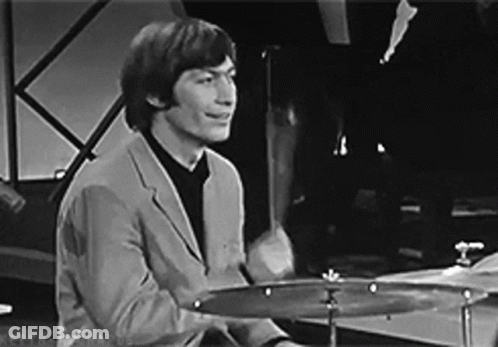 Man In Suit Playing Drums Black And White GIF