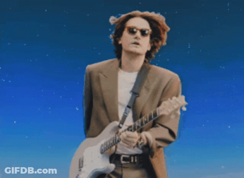 Man In Suit Playing Guitar Blue Sky GIF