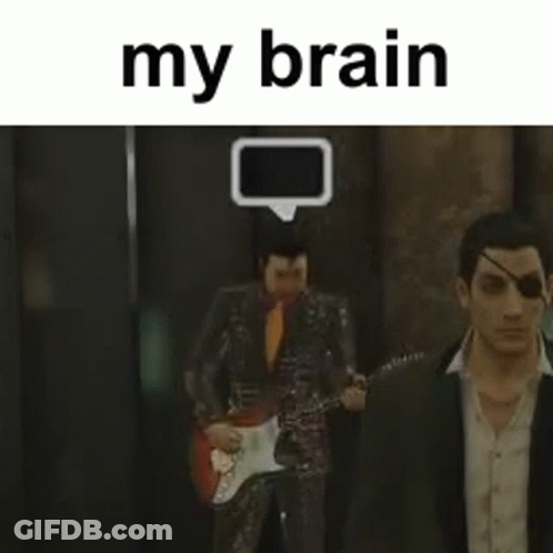 Man In Suit Playing Guitar With Another Man Behind GIF