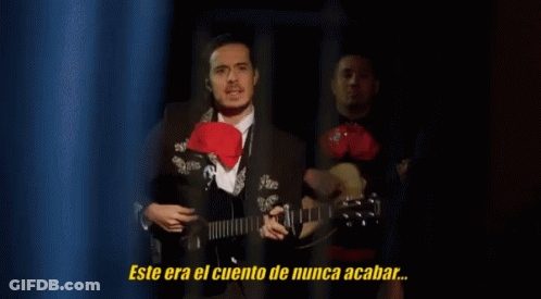 Man In Suit Playing Guitar With Never Ending Story GIF