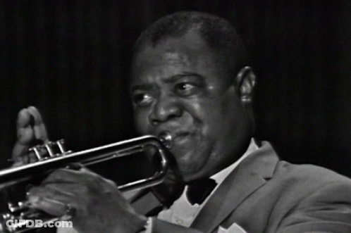 Man In Suit Playing Trumpet GIF