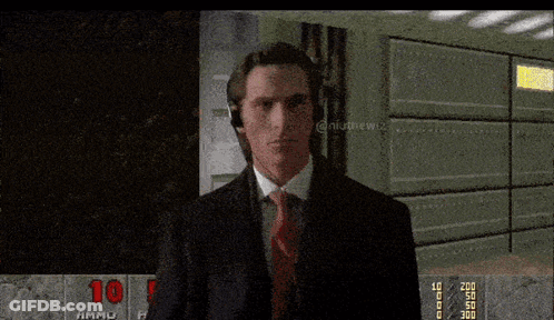 Man In Suit Playing Video Game With 10 GIF
