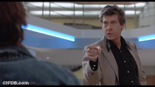 Man In Suit Pointing At Another Man GIF